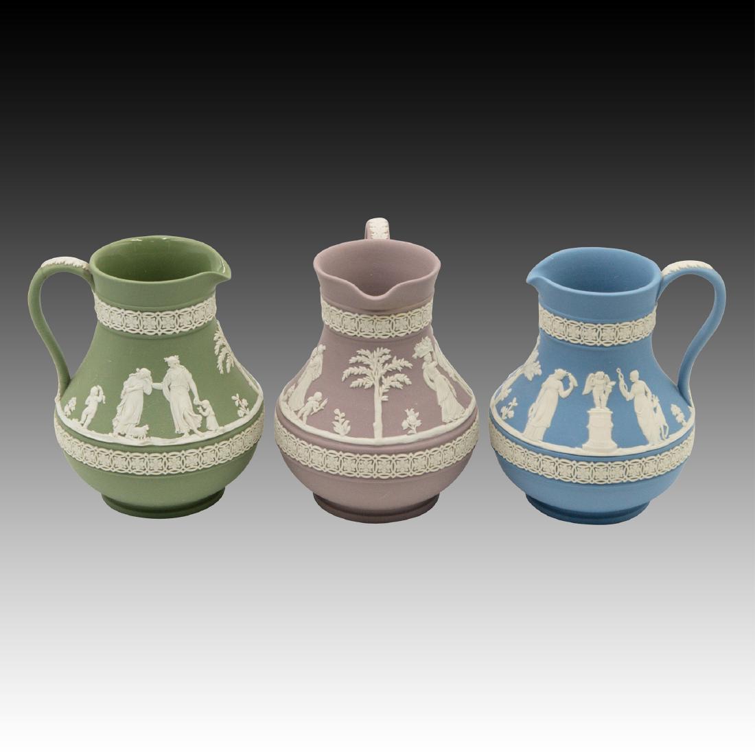 3 Vintage Wedgwood Jasperware Pitchers: in various colors, including a standard green with glossy interior, a standard blue and a rarer mauve. Fun to find in 3 colors. ; Size: 5" Tall;