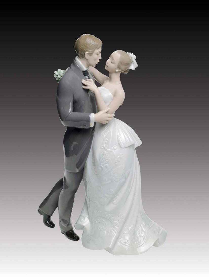 Lladro Lovers' Waltz Figurine 8509: Spanish Name: El Vals De Los Novios Sculptor: Virginia Gonzalez Year Issued: 2010 Year Retired: N/A Finish: Glazed Height (in): 11.75 Width (in): 8.25 ; Country of Origin: Spain;