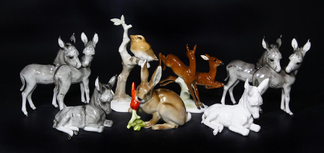 Group of 7 Hutschenreuther Animal Figurines: Group of 7 Hutschenreuther Animal Figurines. Circa mid 20th century. 1) Bunny Rabbit with carrot designed by Karl Tutter (4"L x 4"H x 2"W). 2,3) Pair of laying donkey figurines designed by H. Achtzige