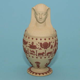 Wedgwood Primrose Jasper Canopic Jar: Modern Wedgwood Primrose Jasper Canopic Jar, England, c. 1978, with applied terra-cotta jasper bands of hieroglyphs and zodiac signs above Egyptian motifs, impressed mark, ht. 9 1/4 in. =; Country of