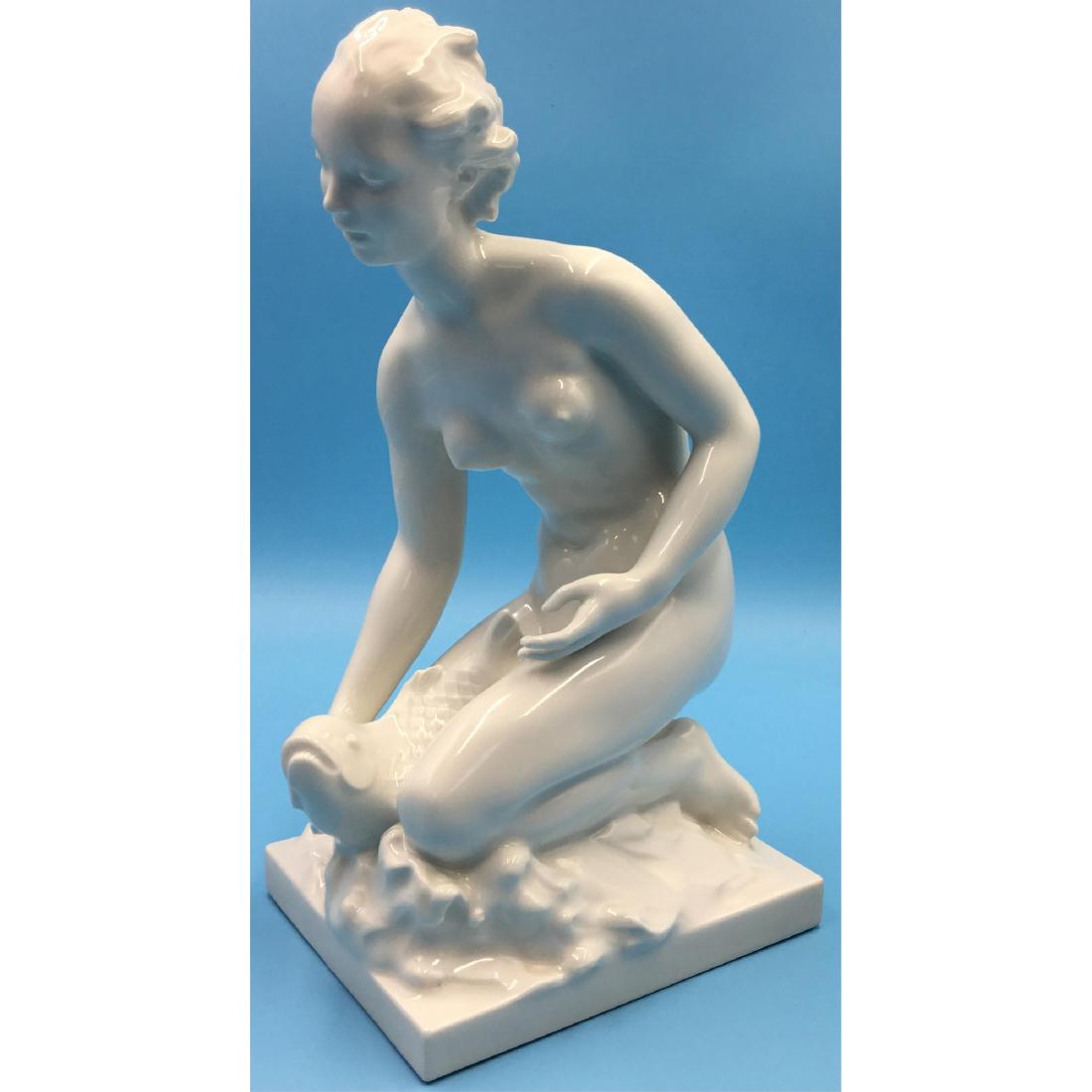 KPM Berlin Blanc De Chine Nude With Fish Figurine: KPM Berlin Germany Blanc De Chine Porcelain Nude With Fish Figurine. Circa 1900s. ; Dimensions: 10"H x 5.5"L x 4.25"W;