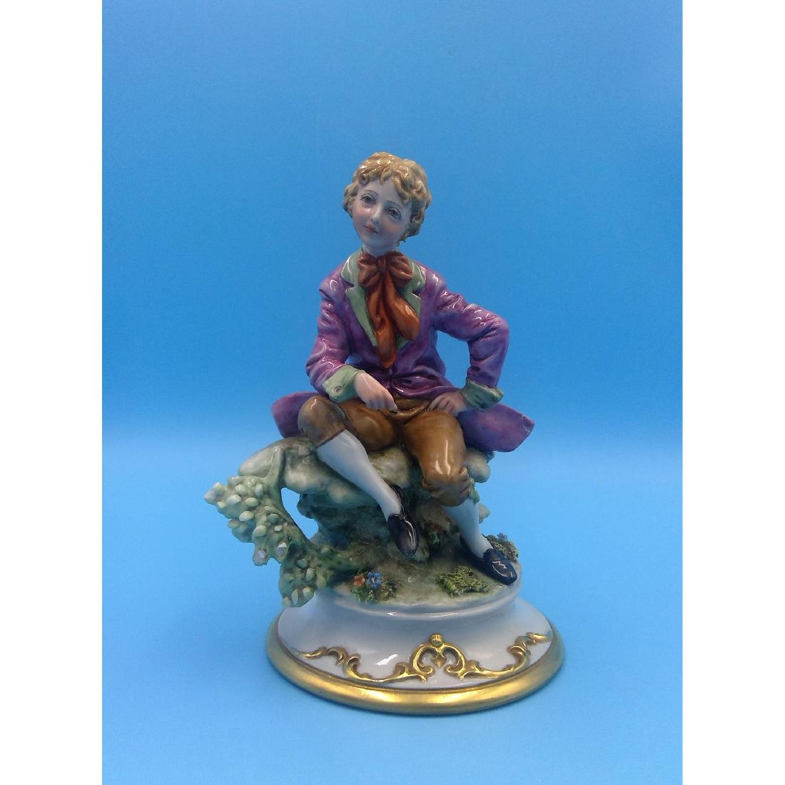 CAPODIMONTE ITALIAN PORCELAIN BOY FIGURINE: Capodimonte Italy King's Porcellane Figure of a Boy. Signed by the artist on the back, marked on the bottom. Circa mid 20th century. ; Dimensions: 7"H x 4.25"D on base;