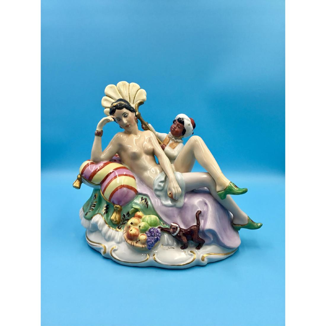LARGE PORCELAIN GROUP FIGURINE NUDE WITH BLACKMOOR: Large Bohemian Porcelain Group Figurine of a Nude Lady with a Blackmoor designed by Konigova who used to work for Royal Dux. Signed by the artist on the back of the base. ; Country of Origin: Czech Re