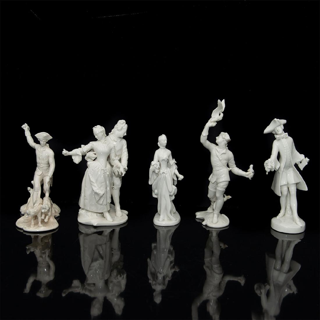 GROUP OF 5 NYMPHENBURG PORCELAIN FIGURINES: Group of 5 Numphenburg Blanc de Chine Figures: 1) Man with a Falcon (9"H x 4"L x 3.5"W). Model number 536. Restoration on flowers. 2) Man with a Glove (7.5"H x 3"L x 3"W). Good condition. 3) Dancing C