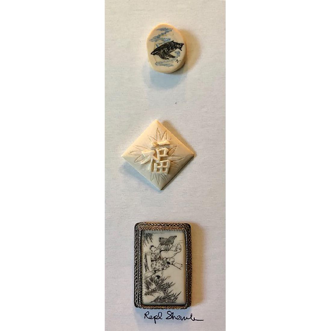 3 NATURAL MATERIAL BUTTONS IN SHAPES: 3 Natural Material Buttons in Shapes. 1 is an Asian Scrimshawed Scene Set in a Rectangular Filigree Silver, 1 is a Shaped Eskimo Scrimshaw in Odd Shape, and One is a Square Carved with Chinese Letter 