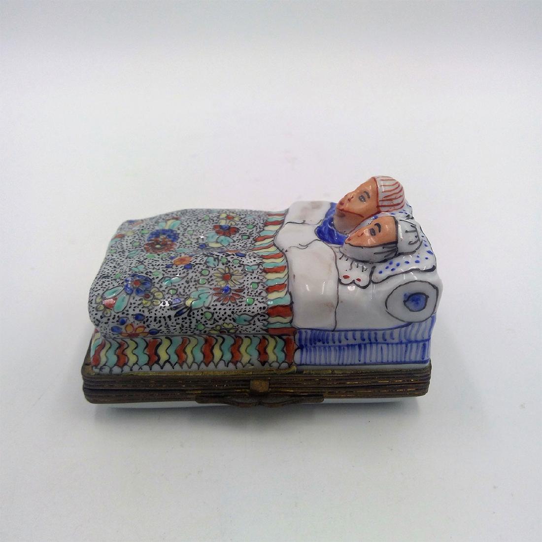 ANTIQUE CHINESE PORCELAIN TRINKET BOX: Porcelain Trinket Box depicting a Sleeping Couple in their Bed. Circa early 20th century. Dimensions: 3.25"L x 2.25"W x 1.75"H;