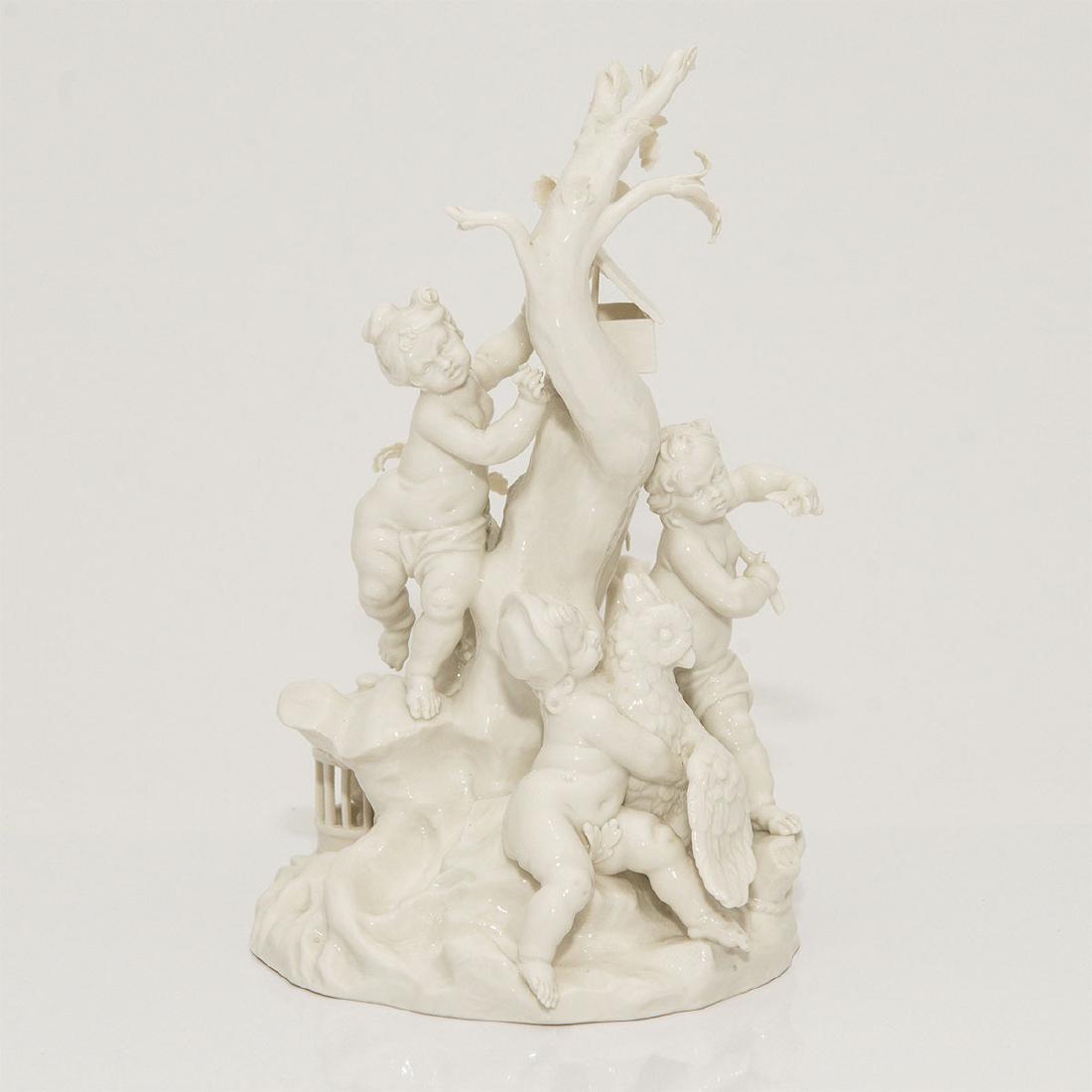 NYMPHENBURG GERMAN PORCELAIN GROUP FIGURINE PUTTI: Nymphenburg Blanc de Chine Figure depicting 4 Cherubs catching Birds. Model number 725/0. Circa early 20th century. Artist: Franz Anton Bustelli; Country of Origin: Germany; Dimensions: 8.5"H x 5.25"D