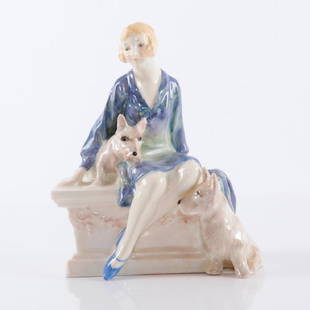 ROYAL DOULTON SCOTTIES HN1349 FIGURINE: SCOTTIES is a very rare Art Deco Royal Doulton figure group designed by Leslie Harradine, and issued in 1929. It depicts a woman sitting on a pedestal with her two wheaten Scottish terriers. A color