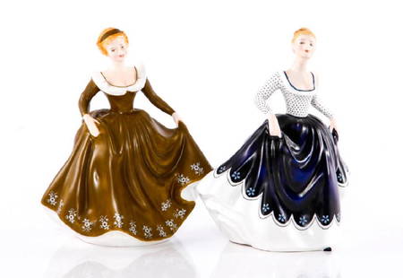 GROUP OF 2 ROYAL DOULTON FIGURINES HN2310, HN234: A group of 2 Matte Finish Figurines designed by Peggy Davies: Lisa HN2310, produced from 1969-1982, and Geraldine HN2348, produced 1972-1976. One of Royal Doulton's most highly regarded figure