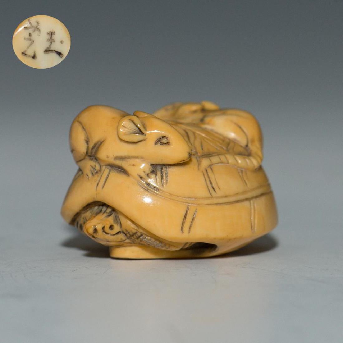 ANTIQUE JAPANESE CARVED BONE NETSUKE RATS ON TURTLE: Netsuke carving of two mice sitting on a turtle. marked on the bottom. Dimensions: 1.5"L x 1"H Country of Origin: Japan