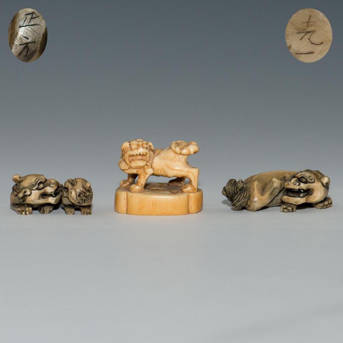 GROUP OF 3 ANTIQUE CARVED BONE NETSUKE FOO DOG FIGURES: Set of 3 netsuke carvings of Foo Dogs. Two are signed on the bottom. Dimensions: Largest 2"L Country of Origin: Japan