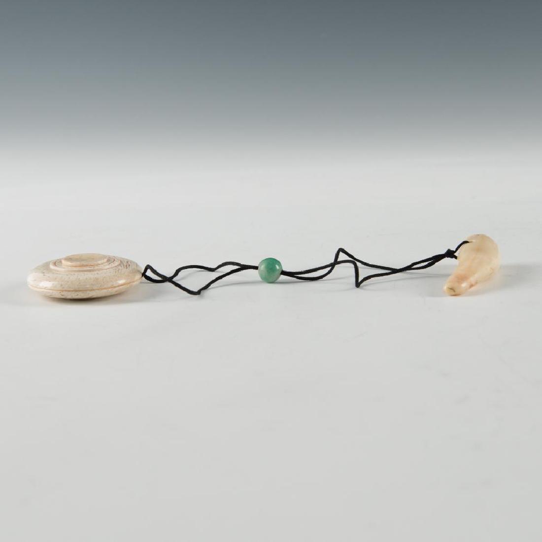 ANTIQUE JAPANESE CARVED BONE & JADE 3pc NETSUKE INRO: Netsuke Inro made of three pieces connected with a cord. Tooth is 2"H, inro is 1.75"D, and a jade bead is about 0.25". Country of Origin: Japan