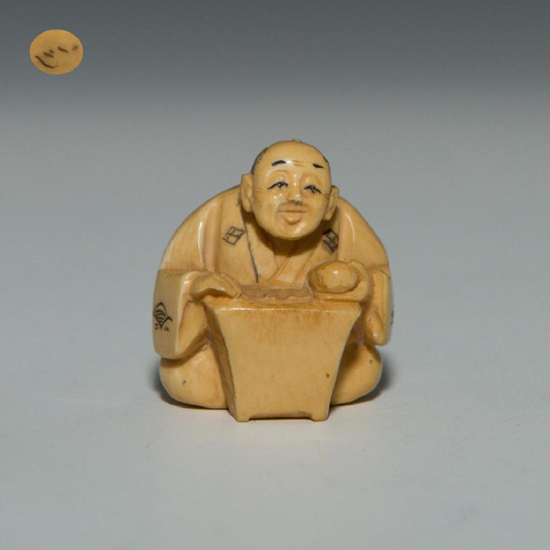 ANTIQUE JAPANESE CARVED BONE NETSUKE MAN GO PLAYER: Netsuke carving as a figure of a man Go player. Signed on the bottom. Dimensions: 1.5"H Country of Origin: Japan