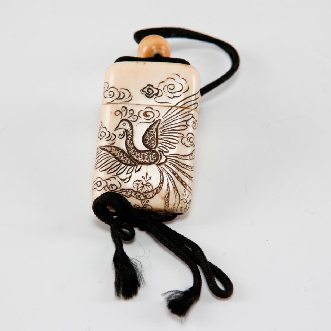 ANTIQUE JAPANESE CARVED BONE INRO NETSUKE FIRE BIRD: Inro netsuke carving with fire birds on both sides. Dimensions: 2"H x 1.25"L Country of Origin: Japan
