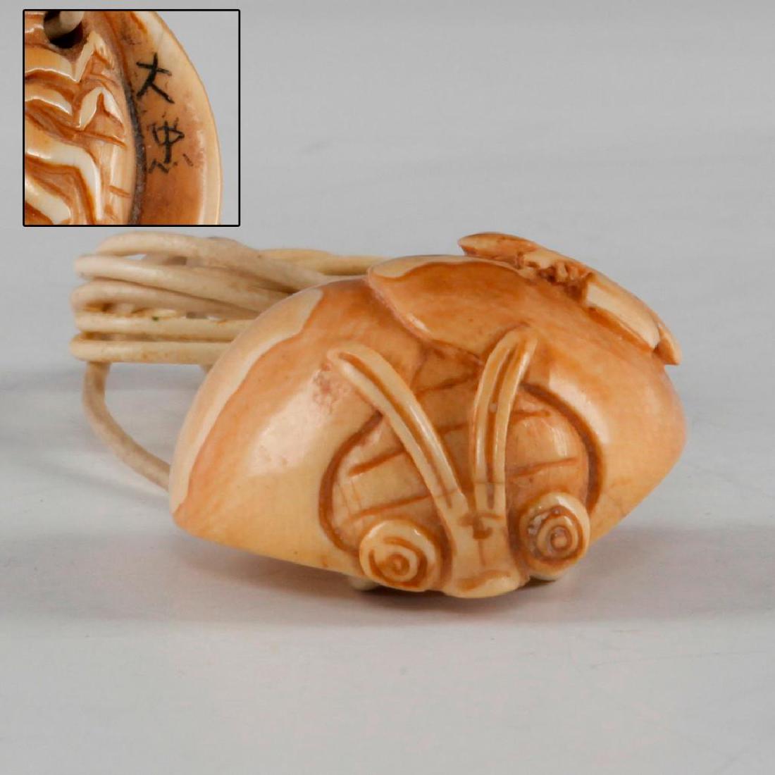 ANTIQUE JAPANESE CARVED BONE NETSUKE BUG & BUTTERFLY: Netsuke carving as a butterfly sitting on a bug. Signed on the side. Dimensions: 1.5"H Country of Origin: Japan