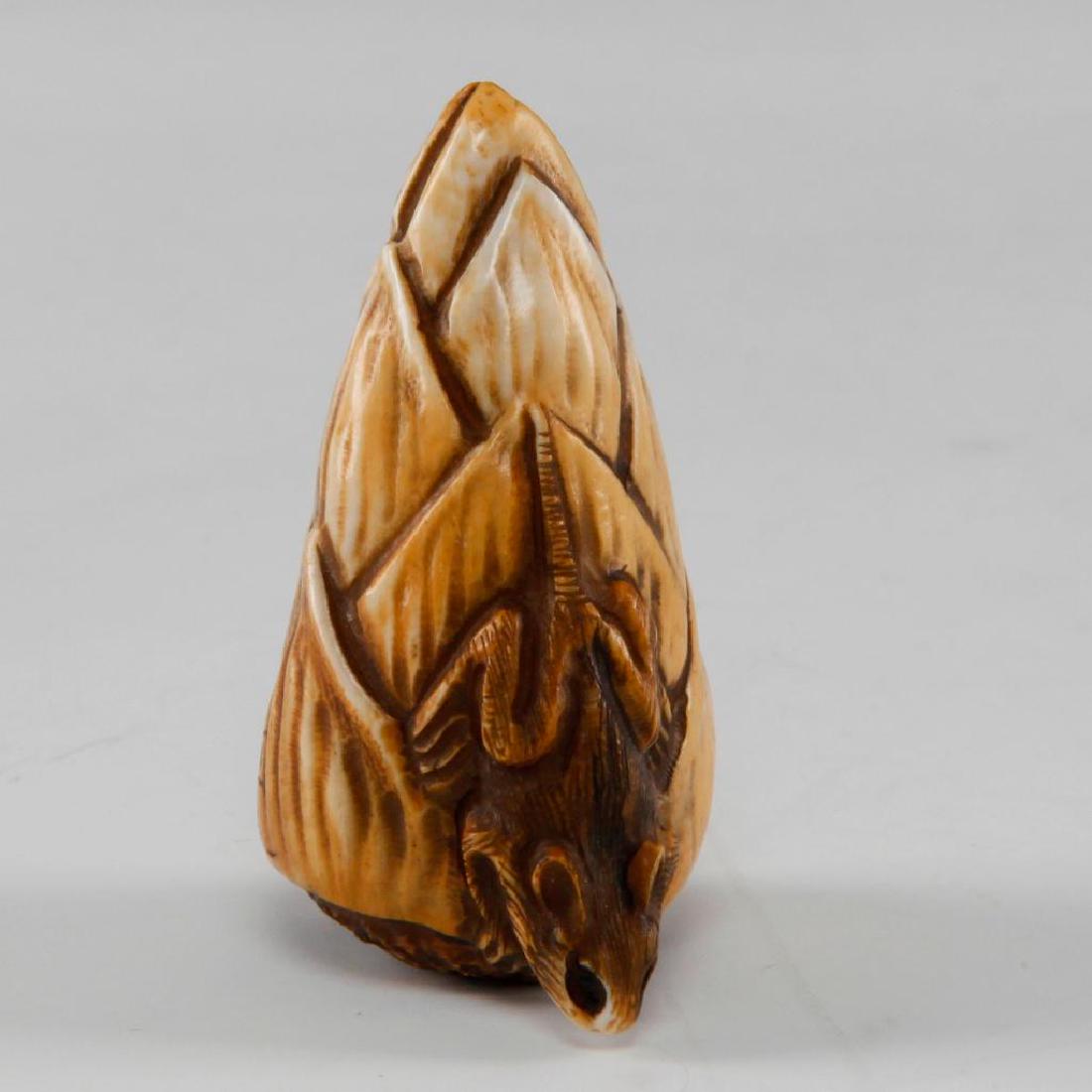 ANTIQUE JAPANESE CARVED BONE NETSUKE MOUSE ON CORN: Netsuke carving as a mouse sitting on corn. Signed on the bottom. Dimensions: 1.75"L Country of Origin: Japan
