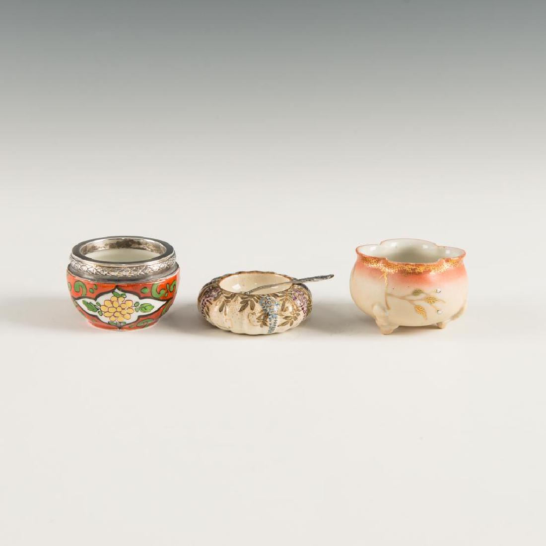 GROUP OF 3 ANTIQUE JAPANESE PORCELAIN BOWLS SALT CELLAR: Set of 3 finely painted dishes, 1 with silver rim, sterling spoon Dimensions: Largest 1.25"H