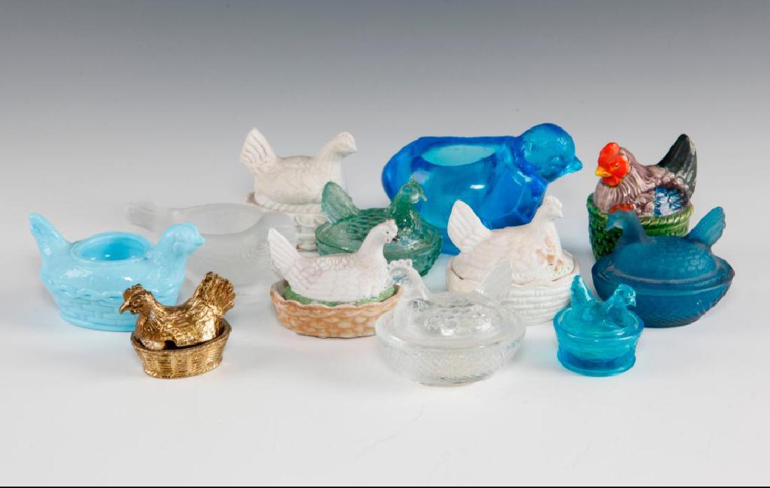 GROUP OF 12 VINTAGE CHICKEN & SPARROW SALT CELLARS: Various glass, porcelain and one metal chicken & bird salts. Dimensions: Largest 4"L