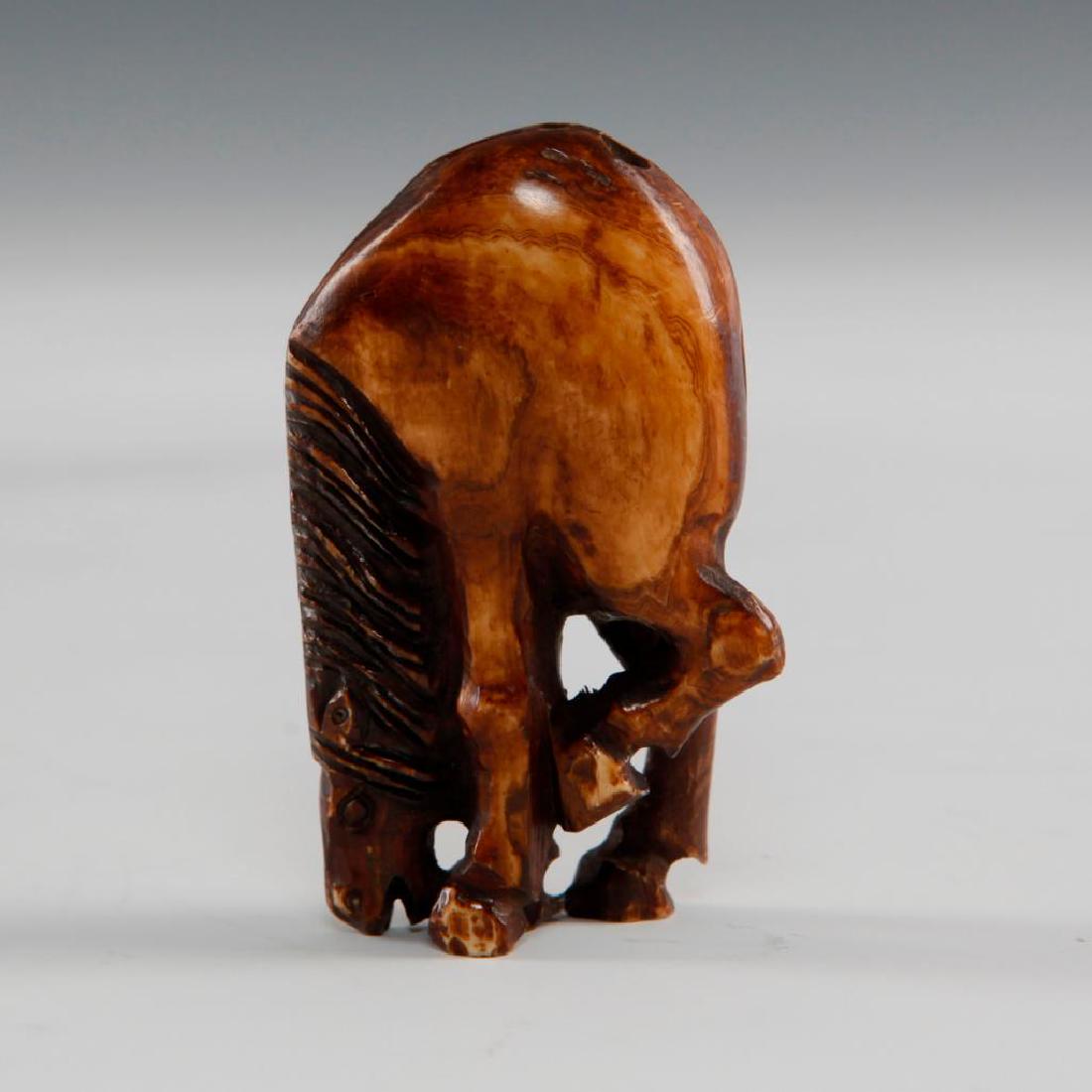 ANTIQUE CARVED BONE NETSUKE HORSE FIGURINE: Netsuke carving in shape of a horse. Dimensions: 2.25"H Country of Origin: Japan