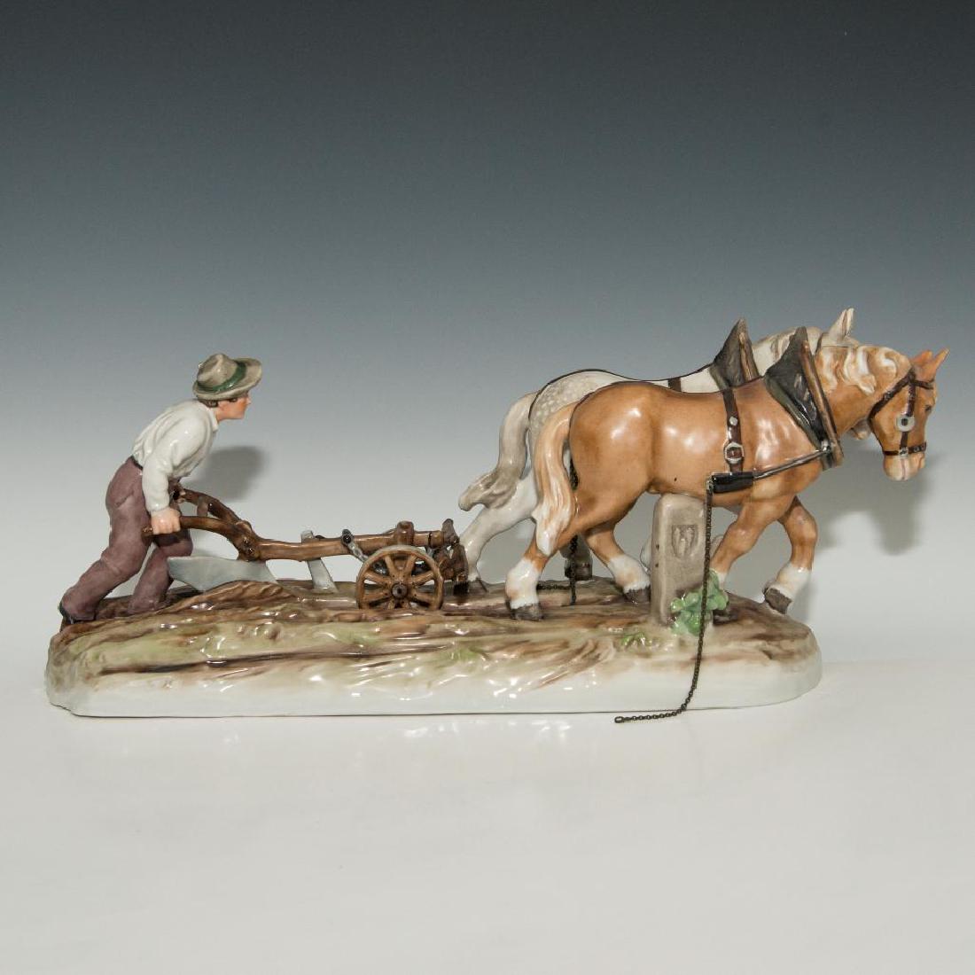 VON SCHIERHOLZ GERMAN PORCELAIN SCULPTURE FARMER: Von Schierholz Figurine of a man working with a plow and horses Marked on the bottom. Dimensions: 17"L x 7.5"H x 6"W Issued: circa 1907 Country of Origin: Germany