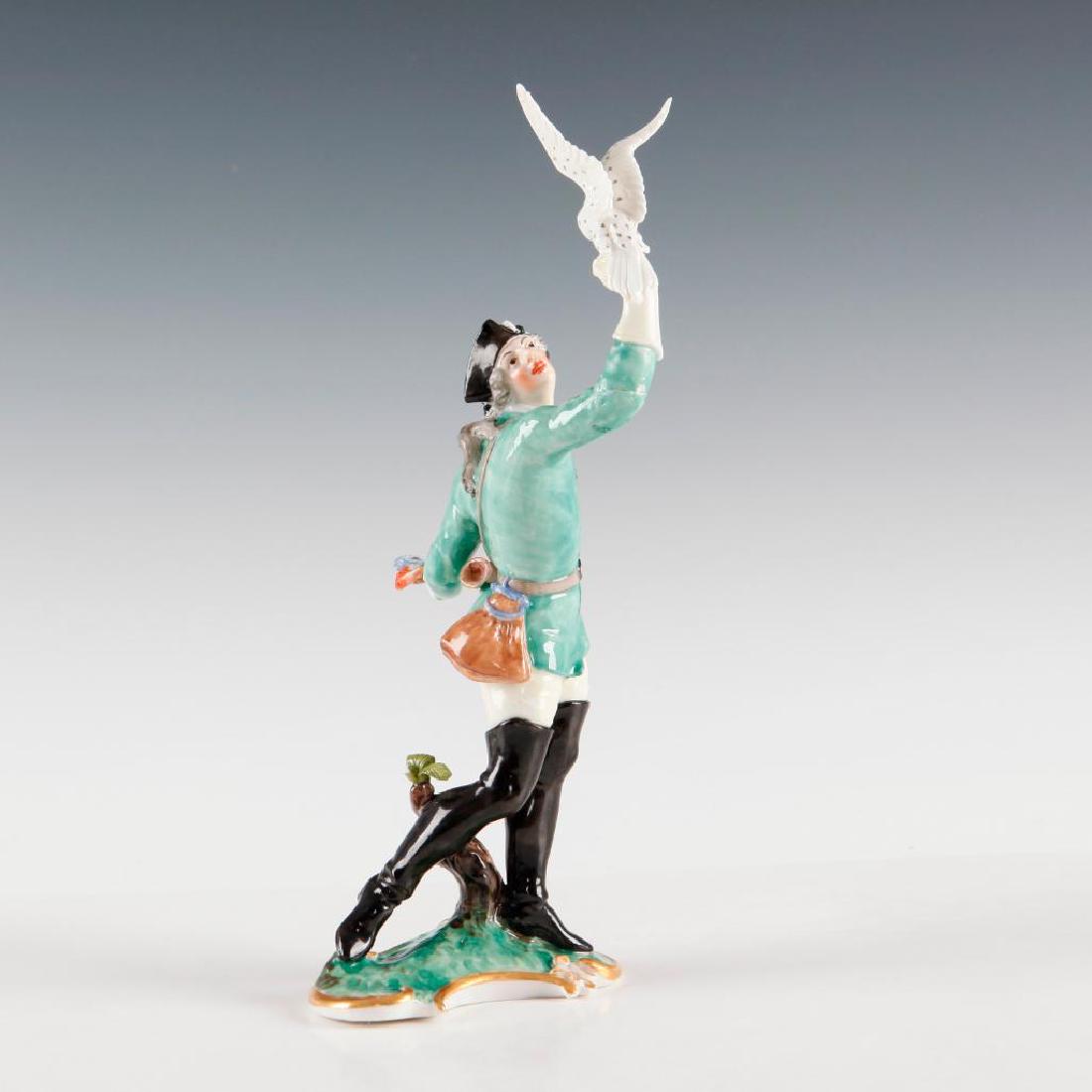 NYMPHENBURG GERMAN PORCELAIN FIGURINE FALCONER: Nymphenburg Figure of a Man with a Falcon. Model number 536/7. Impressed shield marks on the base and on the bottom. Dimensions: 8.5"H Issued: circa 1900s Country of Origin: Germany