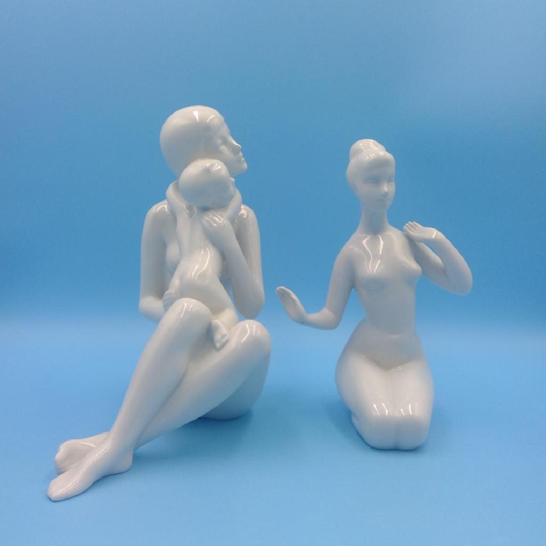 GROUP OF 2 ROYAL DUX BOHEMIAN NUDE FIGURINES: Pair of Royal Dux figures. 1) Mother and Child model number 21056 (8"H x 7"L x 4"W). 2) Seated nude Woman (7"H x 5"L x 4.5"W). Circa mid 20th century. Country of Origin: Czech Republic