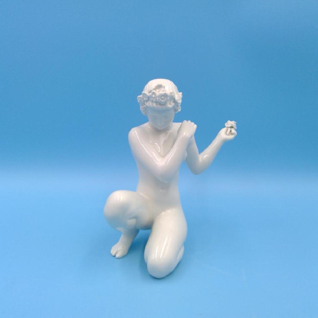 ARNO MALINOWSKI B&G NUDE DANISH FIGURINE: Arno Malinowski for Bing & Grondahl Blanc de Chine Porcelain Figurine of a Nude woman with Flowers. Dimensions: 6.5"H x 5"L x 5"W Issued: circa 1920s Country of Origin: Denmark