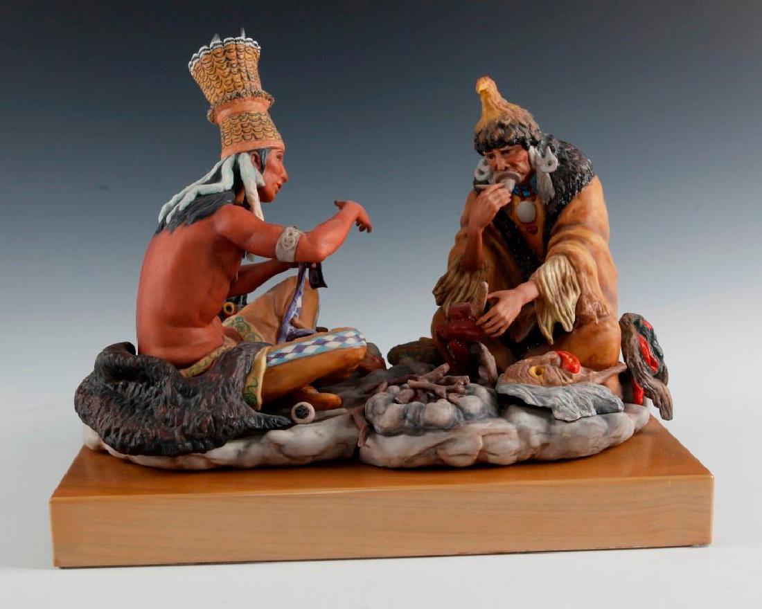 CYBIS PORCELAIN GROUP FIGURE, IROQUOIS THE COUNCIL FIRE: Depicting historic Iroquois leaders Dekanawida and Atotarho. Dimensions: 13.25"L Issued: 1975 Edition Size: 500 Edition Number: 430 Country of Origin: United States
