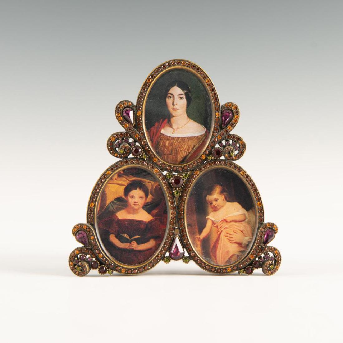 JAY STRONGWATER TRIPLE PICTURE FRAME SWAROVSKI & ENAMEL: Darby frame from St. Petersburg collection. Finely decorated with Swarovski crystals and red enamel. Marked on the back. Dimensions: 4.75"H x 4.75"W Country of Origin: USA