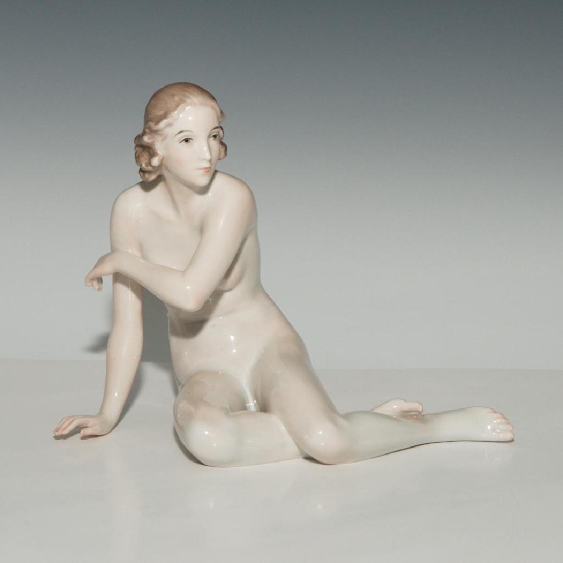ROSENTHAL PORCELAIN FIGURINE SEATED NUDE: Rosenthal figurine called "Liana". Model number P962. Dimensions: 8"L x 6.5"H x 4.5"W Issued: c.1938-1940 Country of Origin: Germany Artist: Max H. Fritz