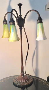 ANTIQUE TIFFANY STUDIOS 21" FAVRILE BRONZE LILY LAMP: Tiffany Studios New York Bronze Adjustable Three Light Lily Lamp. Shades are marked LCT , also found Favrile on one of them. Dimensions: 21"H x 13.5"W Issued: Circa early 20th century Country of Origi