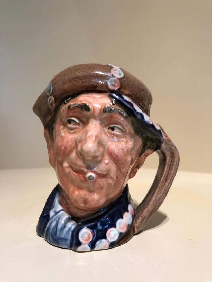 ROYAL DOULTON PEARLY BOY SMALL SIZE JUG WITH BLUE PEAK,: This rare version of the Character Toby Jug Pearly Boy in small size was made a short time. Great details with dark coloring. With Royal Doulton mark to underside. The Pearly Boy is a coster or coster