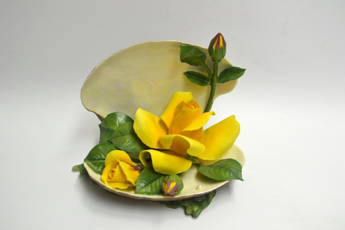 BOEHM PORCELAIN YELLOW ROSE IN OYSTER SHELL: Bisque Porcelain Decorated. Featuring a beautiful Yellow Rose in a Oyster Shell, Fine Bone China. Hallmark: 300-59 Issued: 1981. Closed edition. Dimensions: 6 1/2" H x 7 1/2" W x 6 1/2" D. Edition Num