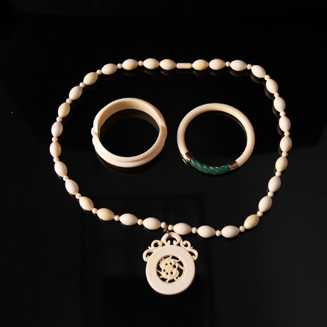 VINTAGE BONE NECKLACE AND BANGLES SET: Vintage Bone Jewelry Necklace and Bangles Set. Vintage Bone Ladies Jewelry Set. Includes a lovely string of hand crafted round and oval beads in 28.25" length. There is a large circular pendant (a ci
