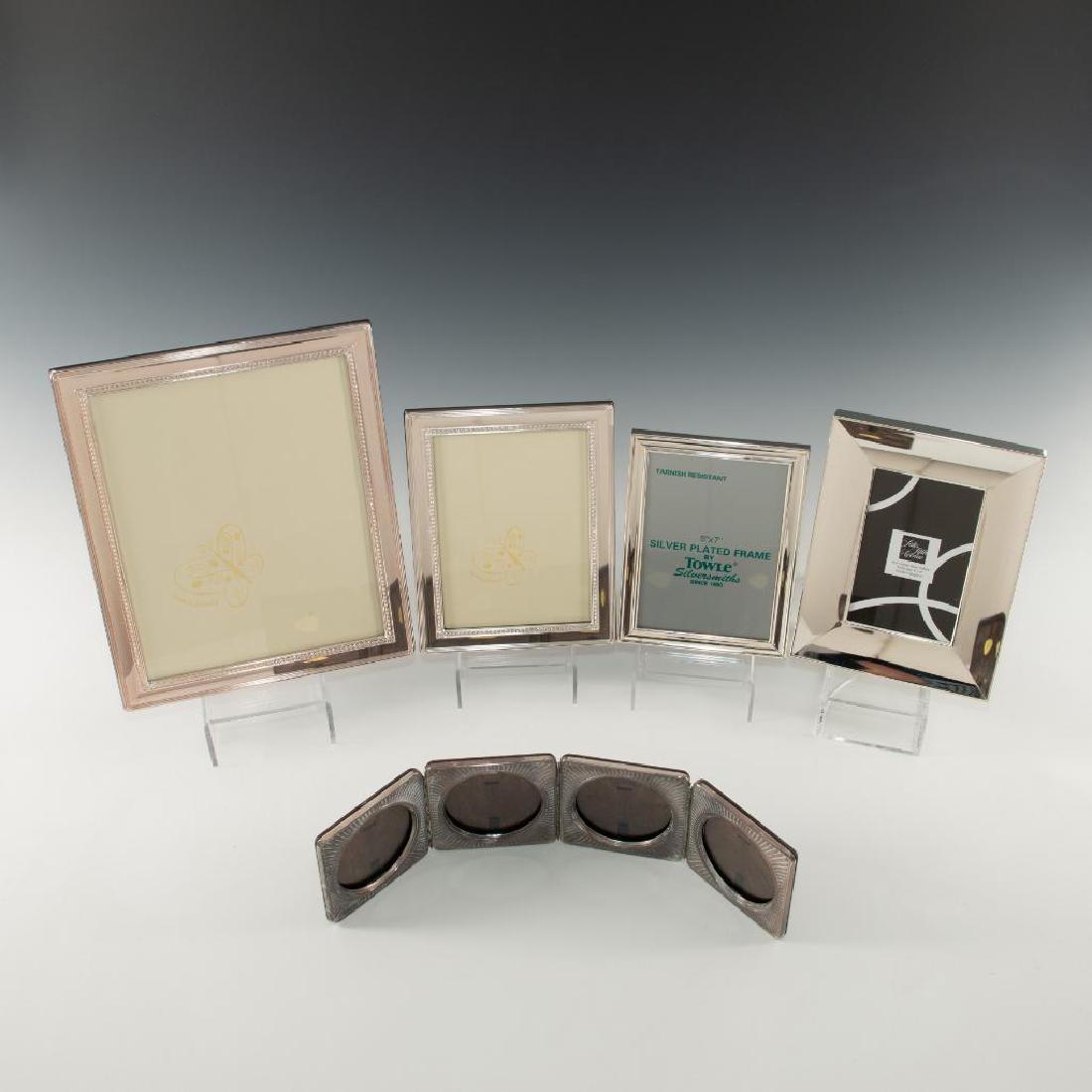 GROUP OF 5 SILVER PICTURE FRAMES SHEFFIELD ENGLAND: Grouping of 5 frames including one for four photos. All frames are silver plated, all are marked. Dimensions: Largest 12"H x 10"W