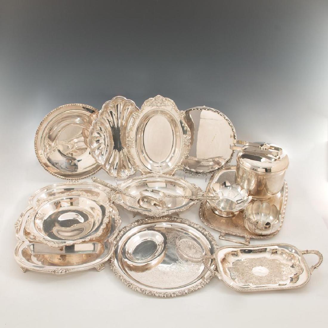 GROUP OF 18 SILVER PLATE SERVICE PIECES: Selection of table service includes ice bucket and trays. Includes Gorham, Wallace, and others. Dimensions: Widest 18" W