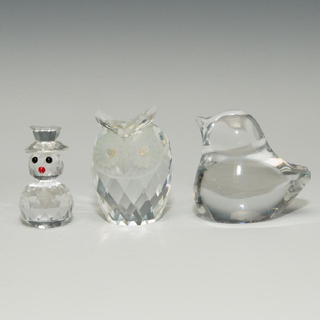 GROUP OF 3 DAUM SWAROWSKI CYRSTAL GLASS PAPERWEIGHT: Group of 3 Art Glass Figurines. Daum France Modern Crystal Glass Sparrow Bird Paperweight (3"L x 2.5"H x 2"W), signed on the bottom. Swarovski Owl Paperweight (2.5"H x 1.75"W), signed on the bottom. C