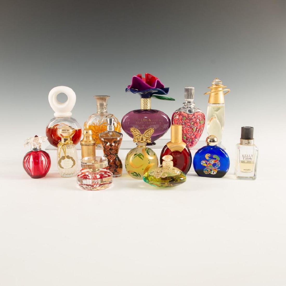 PERFUME BOTTLES 15pc HERMES CARTIER ESCADA RALPH LAUREN: Group of 15 art glass collectible perfume bottles. Including 2 Hermes, 2 Cartier, 2 Escada, 2 Annick Goutal, Marc Jacobs, Ralph Lauren, Jean Paul Gaultier, Lola Lempicka, Bijan, Niki de Saint Phalle a