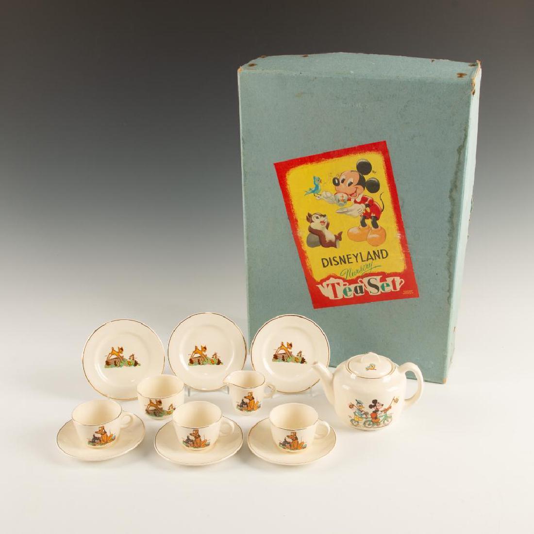 BESWICK THIRTEEEN PIECE DISNEYLAND NURSERY TEA SET: 1950's tea set decorated with Disney characters in orginal box. Decorated with various Disney characters including Mickey Mouse and Donald Duck, Bambi and Thumper, Piper Pig, Pluto and Figaro comprisi