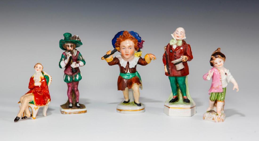 GROUP OF 5 ANTIQUE GERMAN PORCELAIN FIGURINES: Group of 5 miniature figurines by various German makers. 1) Scheibe Alsbach Caricature Boy (4.75"H), model number 15 12695 / G. 2) Oldest Volkstedt Man on a Chair (3"H). 3) Greiner Boy with a Ladybug 