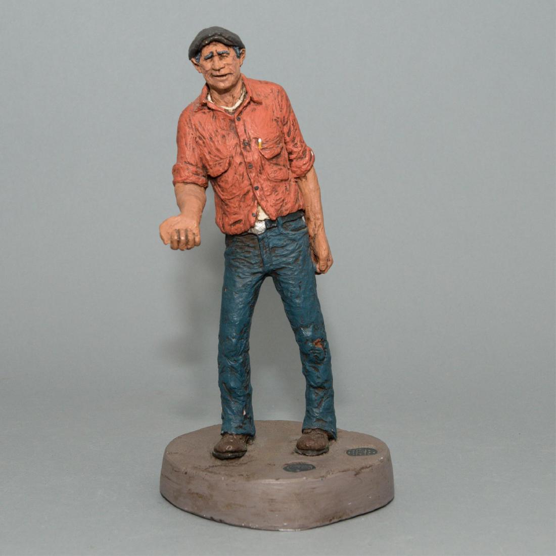 MICHAEL GARMAN SCULPTURE, NEWS MAN, ARTIST SIGNED: A hand decorated sculpture by the Colorado-based American sculptor, produced for his Street Series. Depicts a street vendor standing on the asphalt of a city street. Missing newspapers. Artist signed 