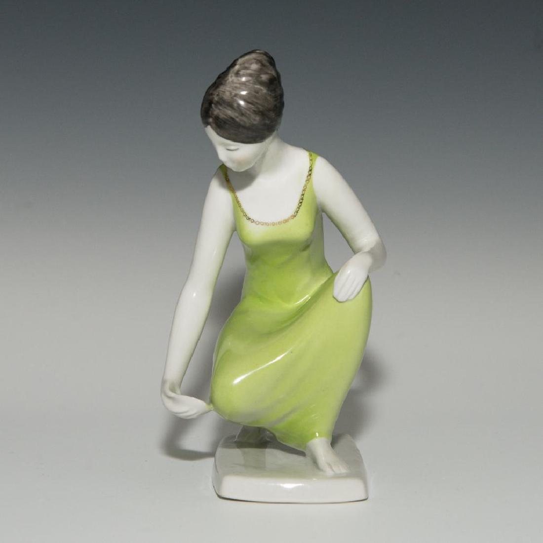 PORCELAIN FIGURINE OF A LADY ARTIST SIGNED: Porcelain Figurine of a Lady in Green Dress executed in modern minimalist style. Signed by the artist on the bottom. Dimensions: 7.5"H x 4"L x 3"W