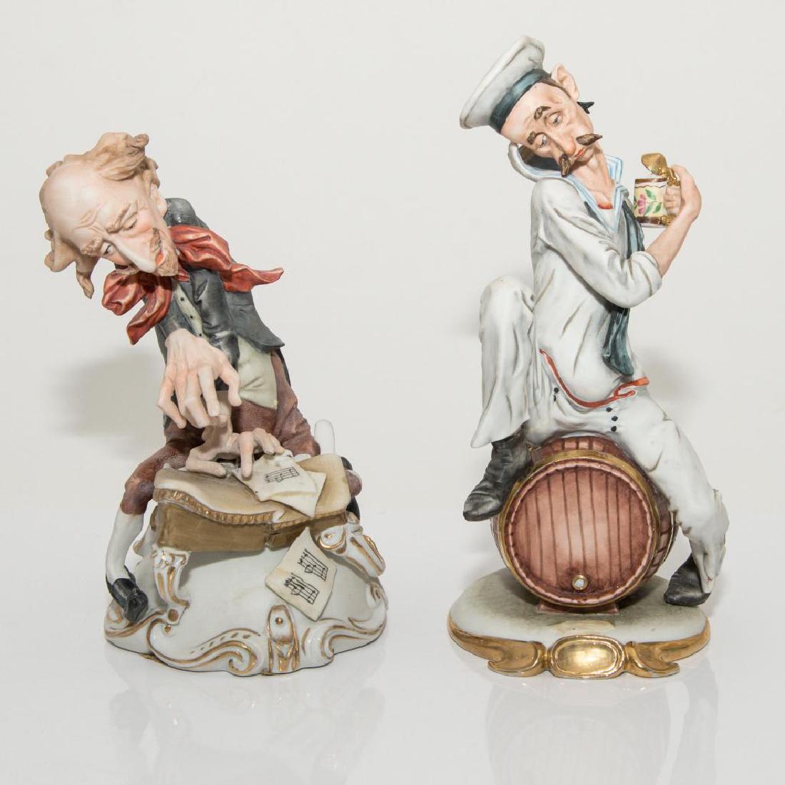 GROUP OF 2 CARICATURE PORCELAIN FIGURINES: Group of 2 Vintage Figurines: 1) Kalk Figure of a Drunken Sailor (10"H x 4.5"D on the base), has a chip on the barrel's cork. 2) Capodimonte Style Figure of a Musician ( 8"H x 5"D), has couple minor c