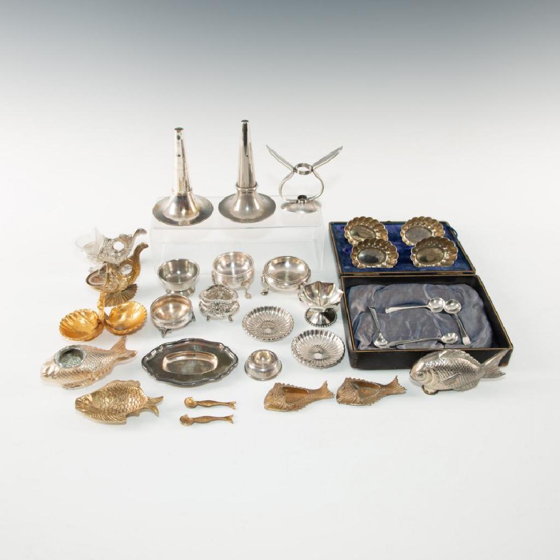 LOT OF 20 PEWTER, PLATE, BRONZE TABLE SALTS AND SETS: Vast variety of styles and sizes, includes James Tufts, Alpadur. A matched set of koi-shaped open salts, a number of Edwardian-styled scroll and thimble salts, matched set of Spanish saucers, and a pr