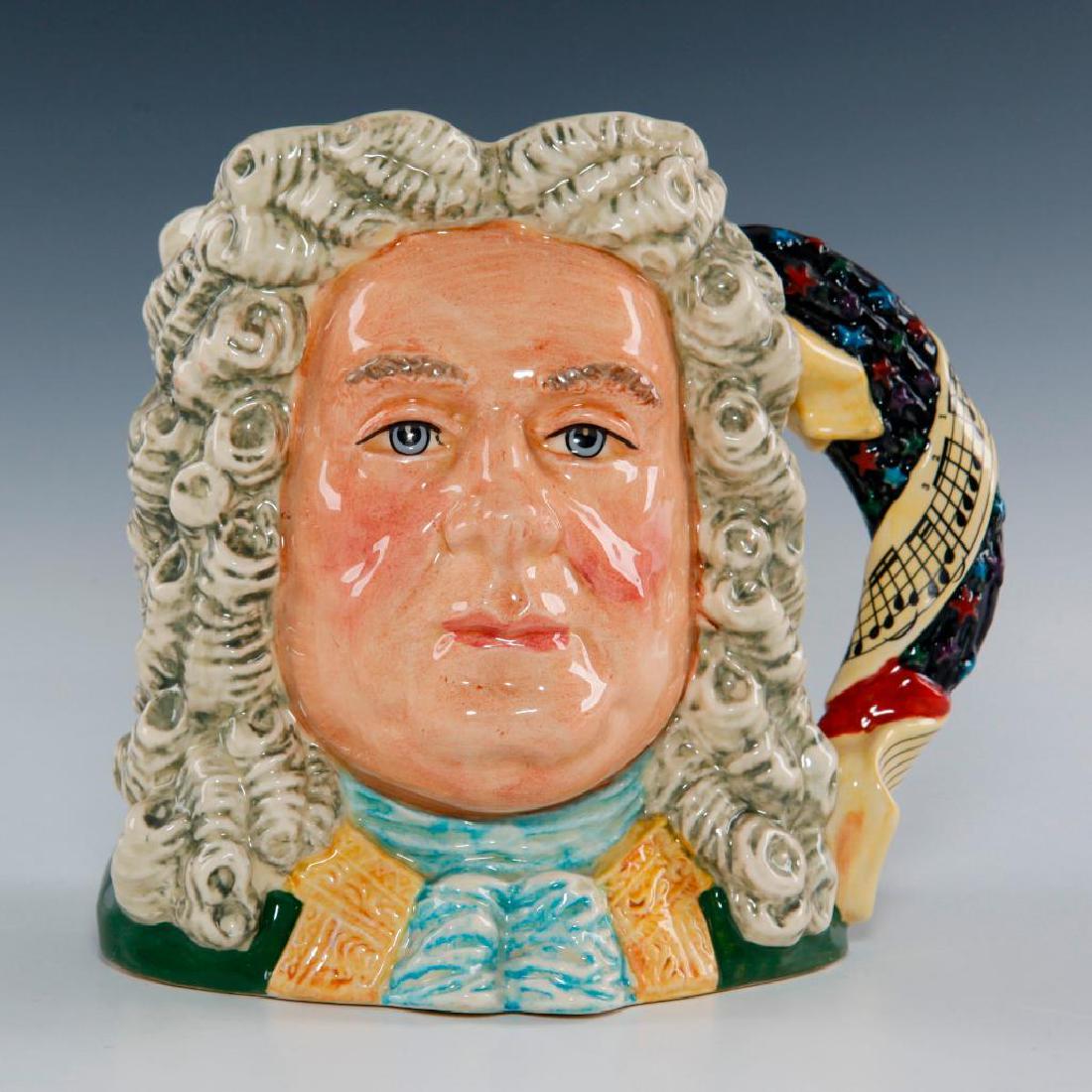ROYAL DOULTON HANDEL LARGE CHARACTER JUG D7080: Character Jug from the Great Composer Series The music score on the handle is from Handel's famous "Fireworks" composition with multi colored stars representing fireworks. Artist: Stanley J. Taylor Is