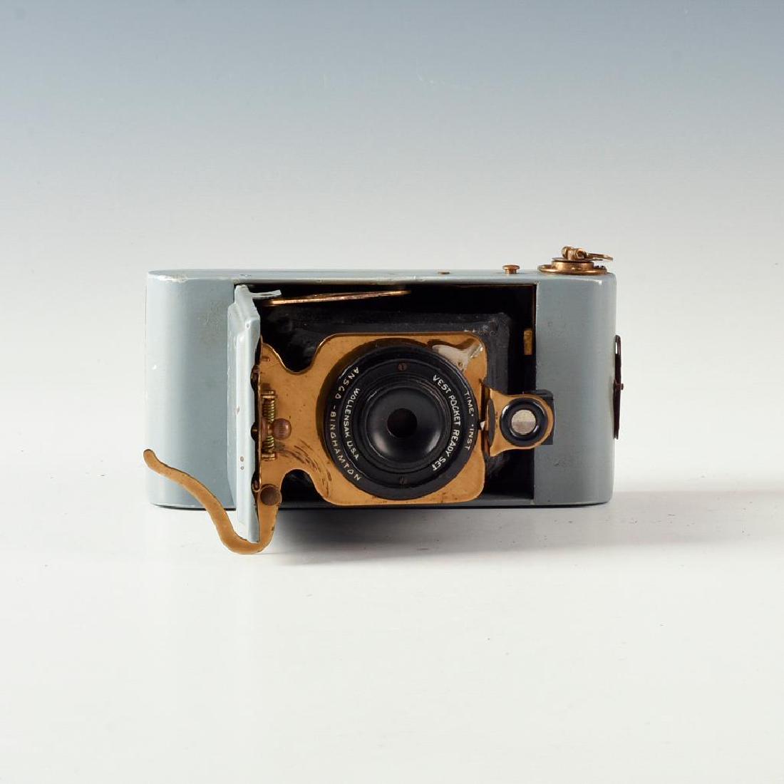 ANTIQUE FOLDING ANSCO CAMERA IN GREY ENAMEL: Brass hardware highlights this Vest Pocket Ready Set model. Issued: 1910's Dimensions: 5"L X 3"D X 4"H Manufacturer: Ansco Country of Origin: United States