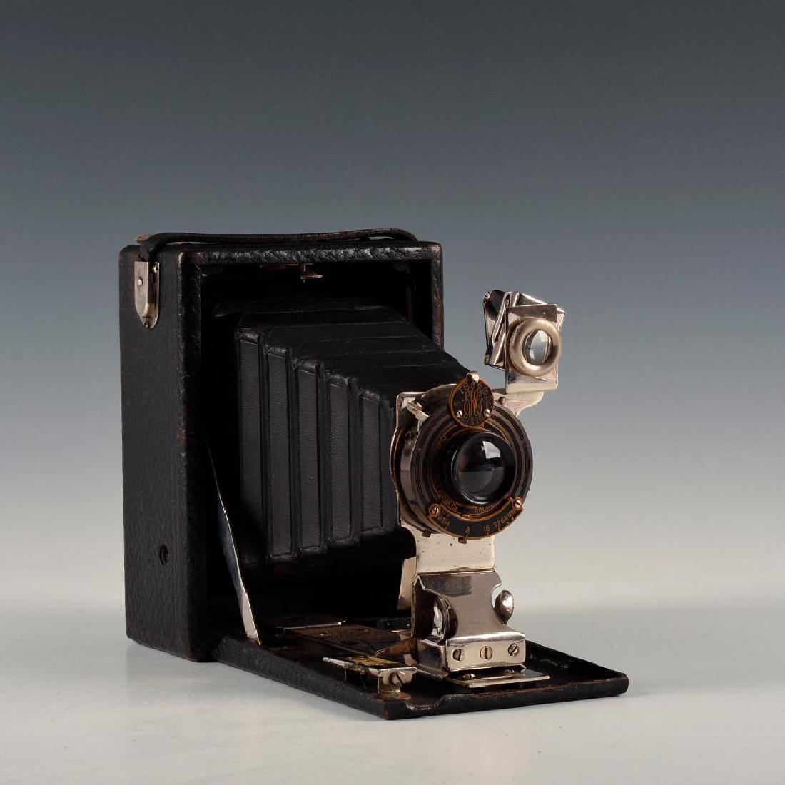 VINTAGE KODAK PREMO FOLDING SHEET CAMERA: Leather bound wooden camera with empty sheet film pack. Issued: 1910's Dimensions: 4"L X 8"D X 6"H open Manufacturer: Kodak Country of Origin: United States