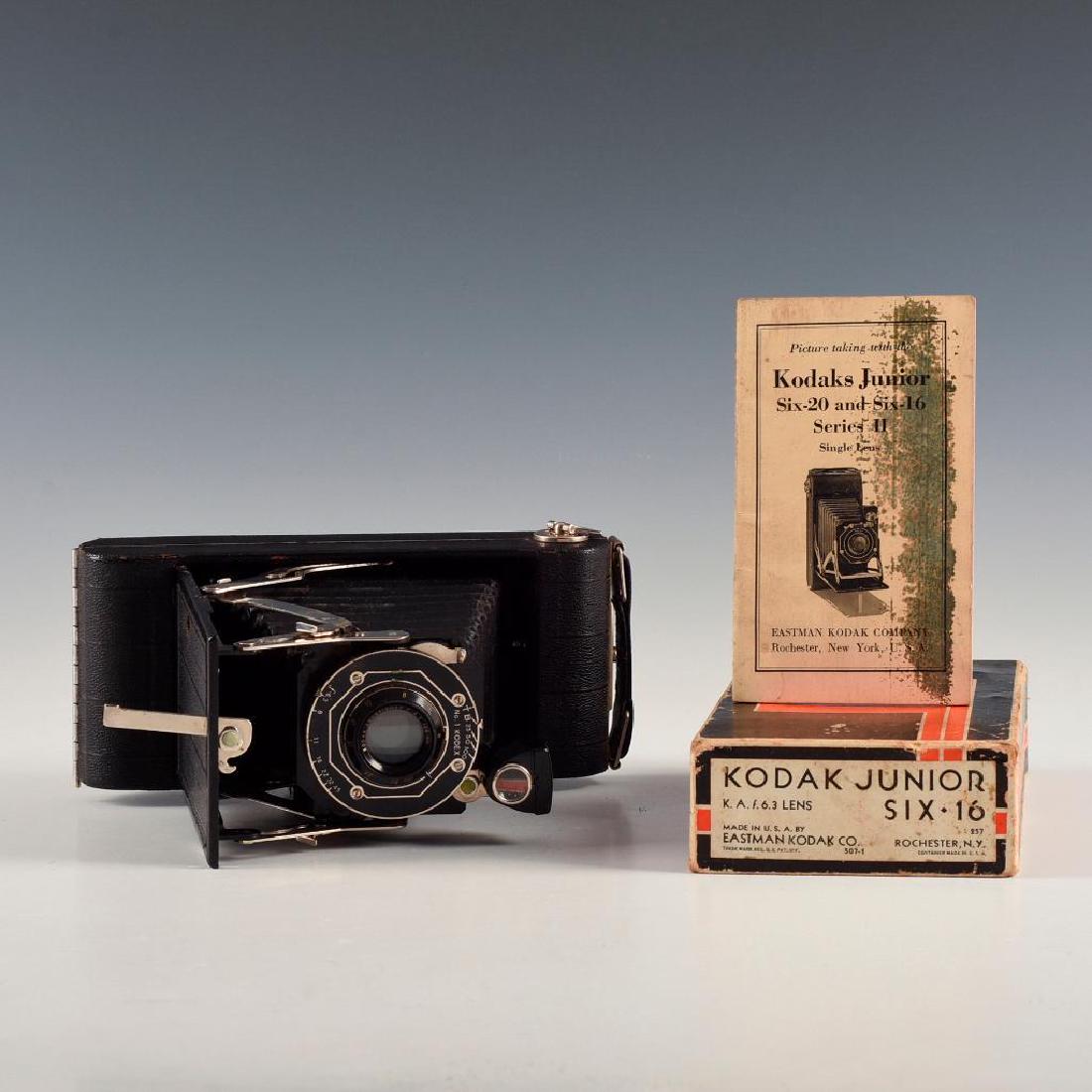 ANTIQUE KODAK JUNIOR SIX-16 FOLDING CAMERA, BOX, MANUAL: Bellows medium format camera with F6.3 Anastigmat lens. Dimensions: 6"L X 3.25"D X 8"H open Manufacturer: Kodak Country of Origin: United States