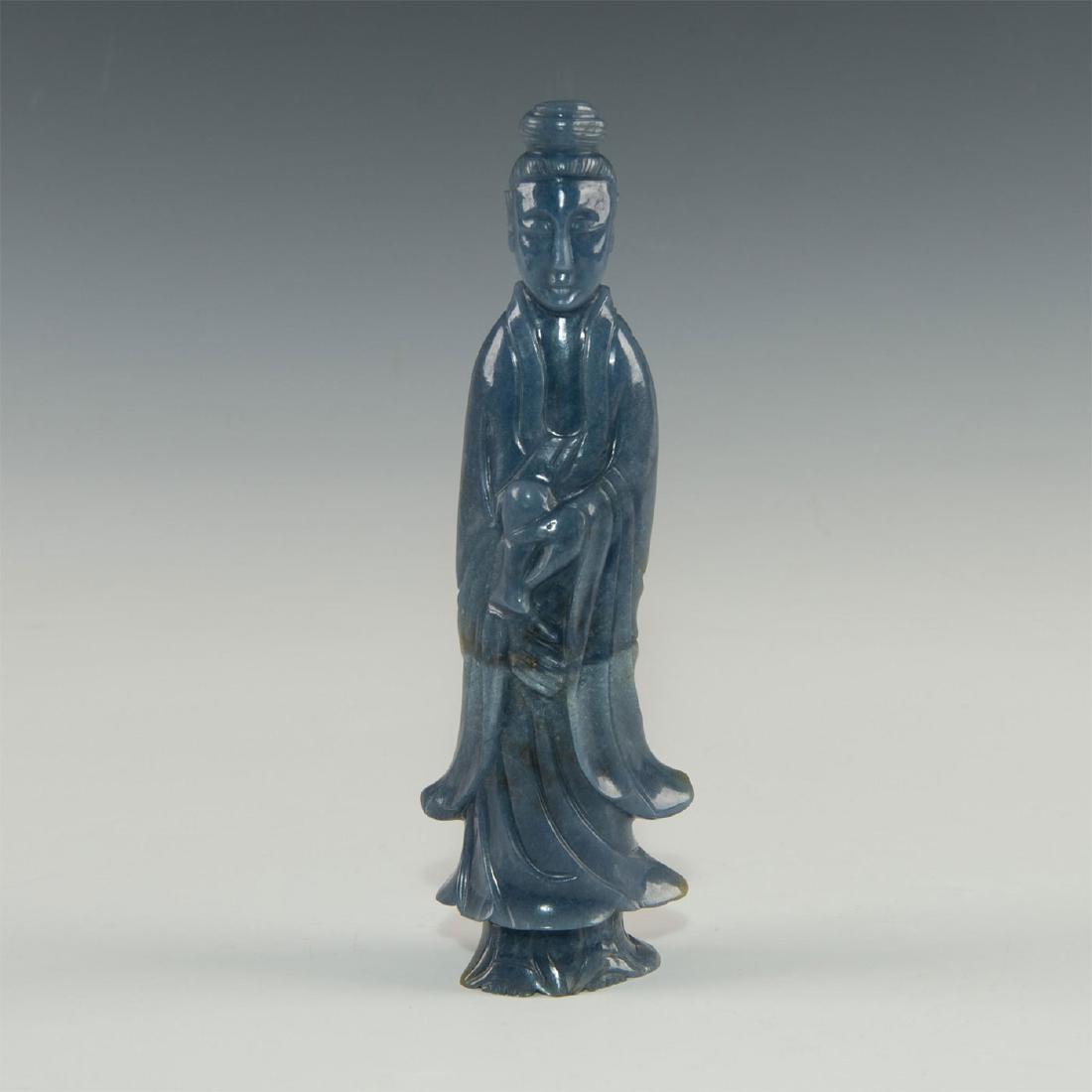 CARVED BLUE JADE GUANYIN FIGURAL STUDY: Natural carved blue jadeite jade. Modeled as Guanyin, a female Chinese divinity. Issued: 19th-20th century Dimensions: 7.35"H Country of Origin: China