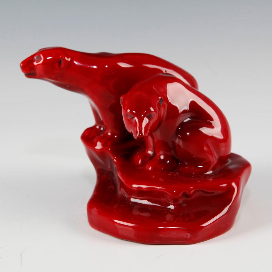 ROYAL DOULTON FLAMBE STUDY OF POLAR BEAR AND CUB ON ICE: Small figure of polar bears on ice floe base in deep red. Early Royal Doulton sculpture of Polar Bears on Ice Floe in Flambe Glaze. Royal Doulton marked underside. Artist: Charles Noke Issued: 1912 Di
